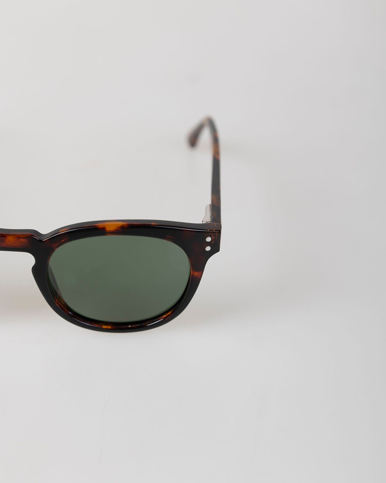Sunglasses with green frame