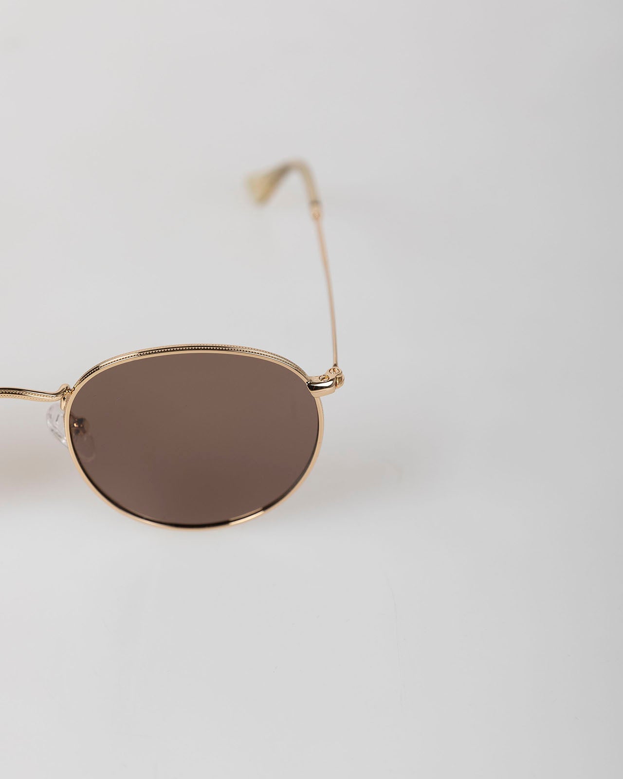 Gold-framed sunglasses