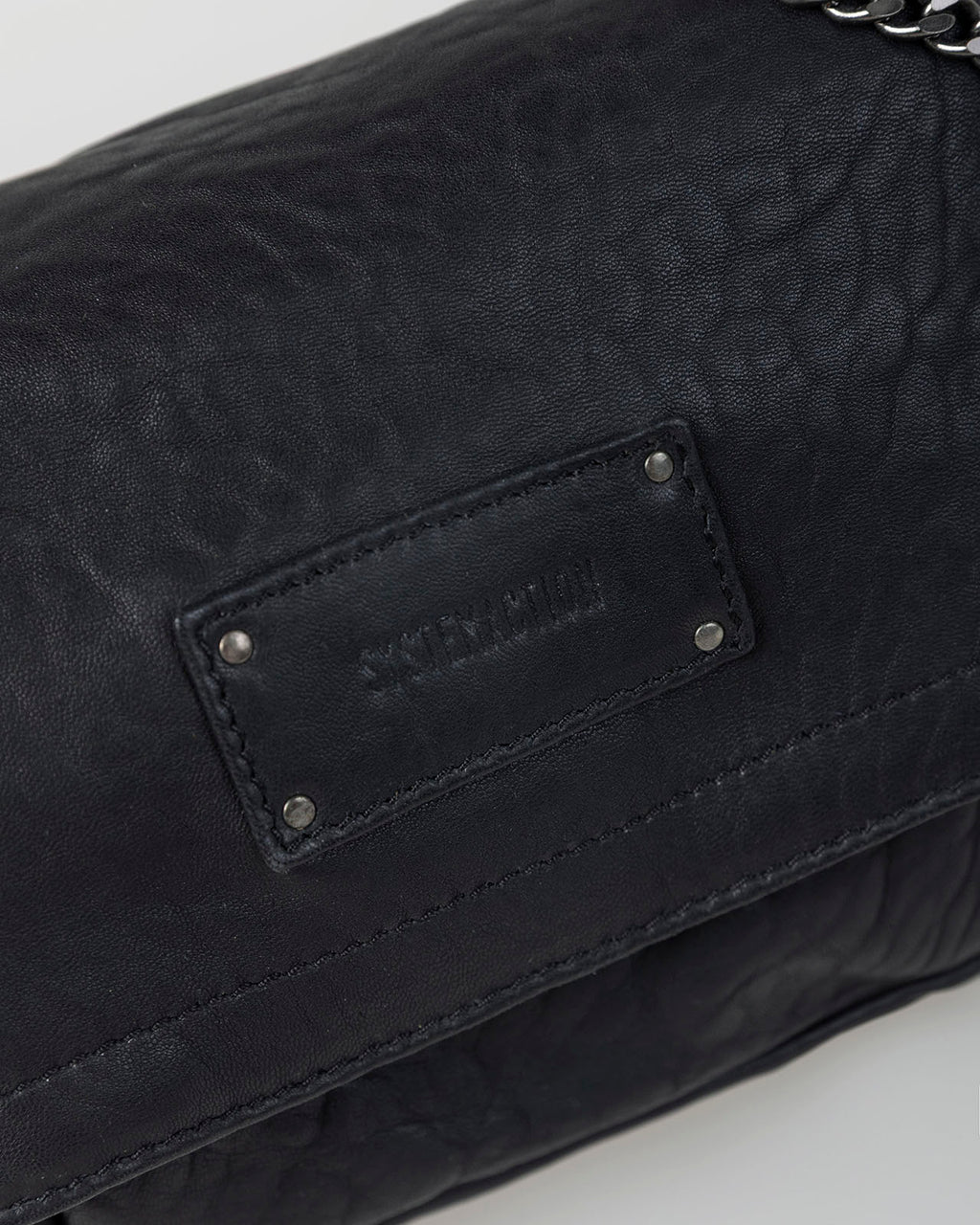 Bolso piel tachas